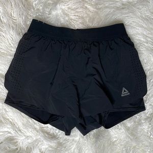 Reebok small running shorts with built in tight shorts